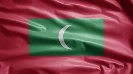 Fototapeta premium Maldivian flag waving in the wind. Close up of Maldives banner blowing soft silk