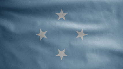 Fototapeta premium Micronesian flag waving in the wind. Micronesia banner blowing soft silk.
