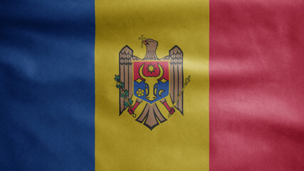 Moldovan flag waving in the wind. Moldavia banner blowing soft silk.