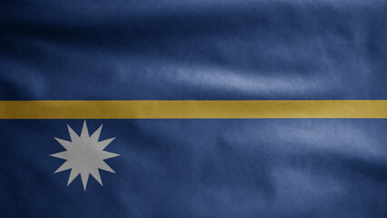 Nauruan flag waving in the wind. Close up of Nauru banner blowing soft silk.