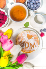 Mothers day Brunch restaurant invitation concept. Various Moms Womans Day Menu background, with traditional breakfast and lunch food and drink set, with flowers on sunny white wooden background