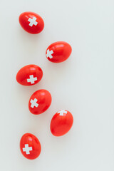 Celebrating Swiss National Holiday on August 1st with traditional eggs colored like swiss flag. Traditional brunch on the day of the Swiss Confederacy founding.