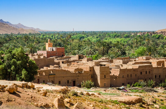 Aoufous, Morocco - April 17, 2015. Traditional muddy houses by palm oasis around river Ziz