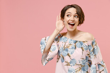 Young curious nosy caucasian woman 20s with short hairdo wearing blouse try to hear you overhear...