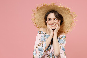 Young excited amazed shy cute caucasian woman with short hairdo in trendy blouse straw hat look...