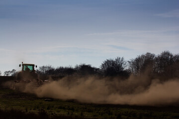 Tractor tilling a field