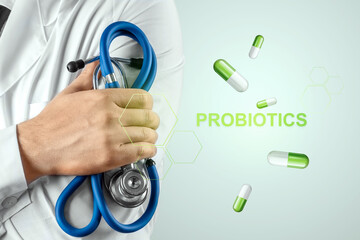 Doctor close-up image of pills and inscription probiotics. The concept of diet, intestinal...