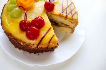 sweet dessert. sponge cake decorated with fruit and jelly 