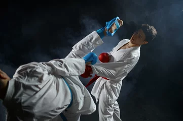Fotobehang Two male karatekas in white kimono and gloves © Nomad_Soul
