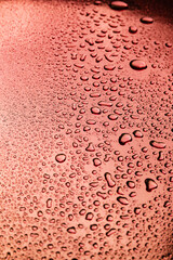 Abstract background with water drops on a copper surface