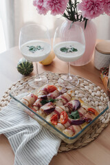 Delicious food table on light background. Top view. Kitchen background.