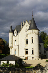 Fototapeta na wymiar old limestone castle with stormy sky in the Loire valley, France