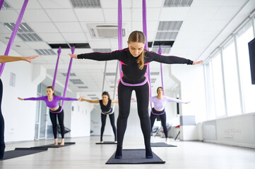 Fly yoga, group training with hammocks