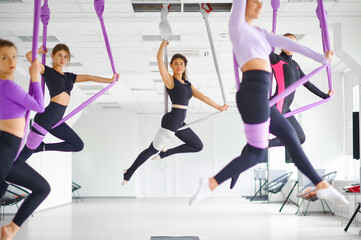 Fototapeta na wymiar Fly yoga class, hanging on hammocks