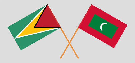 Crossed flags of Guyana and Maldives. Official colors. Correct proportion