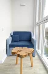 Chair-bed and tea table on the loggia