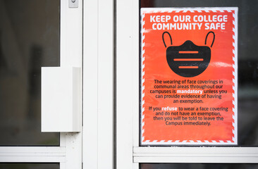 Cover your face using a mask sign at school college door