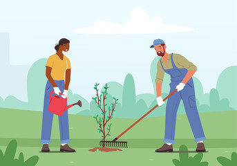 Reforestation, Forest Restoration, Planting New Trees Concept. Man and Woman Volunteers Care of Plants, Environment
