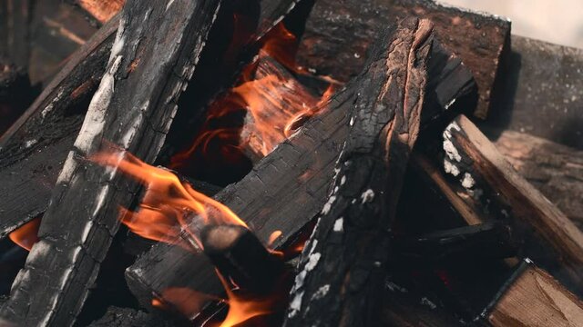 Close up footage of wood in fire, preparing bbq