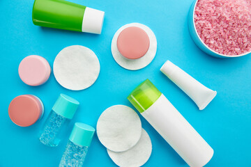 Care products on blue background, nobody