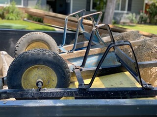 Fototapeta premium wheel barrows in a truck