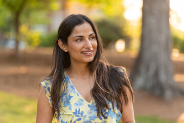 Outdoor headshots of beautiful Asian Indian woman. 