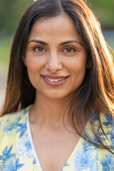 Outdoor headshots of beautiful Asian Indian woman. 