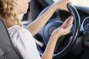 Fototapeta na wymiar woman holding tablets while driving