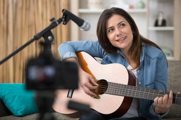 woman recording music video blog home lesson