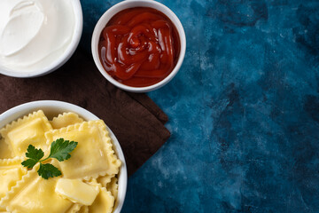 pies with different fillings and hot sauce. Asian dish. Mexican dish. Beautiful background, texture. A gourmet dish. Nice presentation. filling of pies from meat, cabbage, potatoes, seafood, cheese.