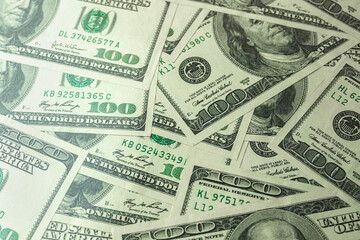 Fototapeta na wymiar Pile of one hundred US banknotes, cash of hundred dollar bills, dollar background photo