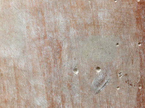 old stained and scratched pale brown wooden board background