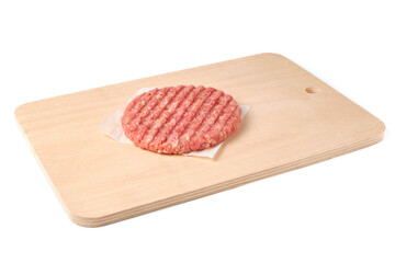 Raw beef burger cutlet on cutting board isolated on white.
