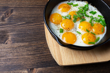 eggs with herbs on a wooden table