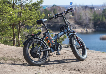 Fototapeta na wymiar Electric bike on the high bank