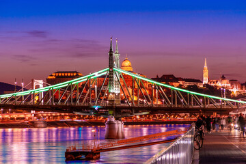 Fototapeta na wymiar Budapest at night, Freedom Bridge on the Danube River, reflection of night lights on the water