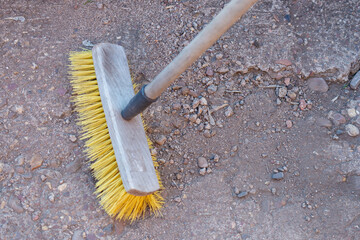 Sweep up concrete and debris with a brush.