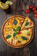 rustic italian pizza with mozzarella, cheese and basil leaves. top view