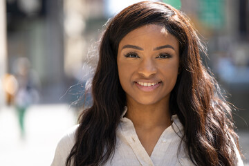 Obraz premium Young black woman in city smile happy face portrait