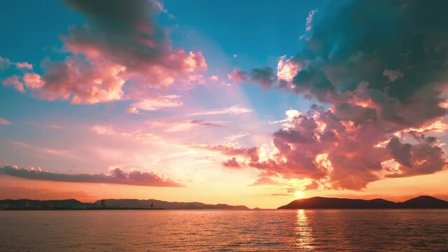 Dramatic Landscape of Sea or Ocean and Shining Golden Sky at Sunset in Summer, Tropical and Environmental Image, Nobody, Time Lapse Background	