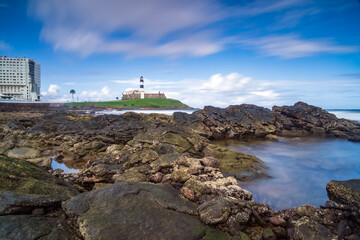 The historic architecture of Salvador in Bahia, Brazil showcasing the Farol da Barra Lighthouse at...