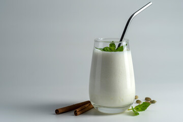 lassi, lassie - indian yogurt drink with spice on white background