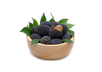 Velvet tamarind in wooden bowl isolated on white background. Black Velvet Tamarind (Dialium cochinchinense)