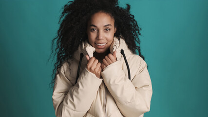 Young African American woman with dark fluffy hair dressed in do