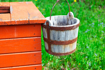 Wooden bucket of water well . Traditional water well in village