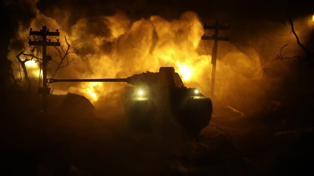 War Concept. Military silhouettes fighting scene on war fog sky background, World War Soldiers Silhouette Below Cloudy Skyline At night. Armored vehicle fight scene. Selective focus