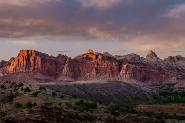 Sunset Lights Up the Red Cliffs of Captiol Reef National Park