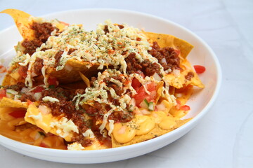 Freshly made nachos with ground beef and cheese