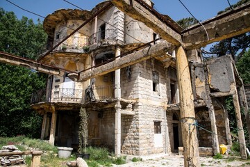 facade of an old and abandoned residential villa in the Lebanon mountain village Dhour Choueir