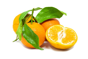 Group of whole and cut mandarines with green leafs on white background